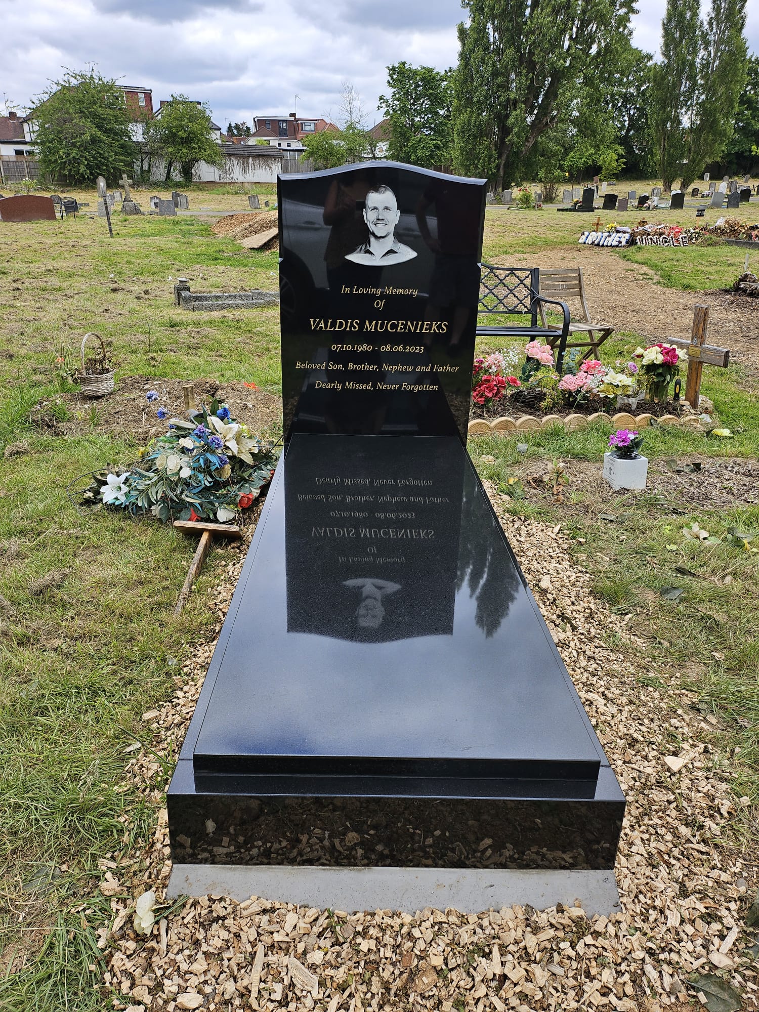 Granite kerb memorial with inscription at Hendon Cemetery, North London - Memorial headstones and masonry